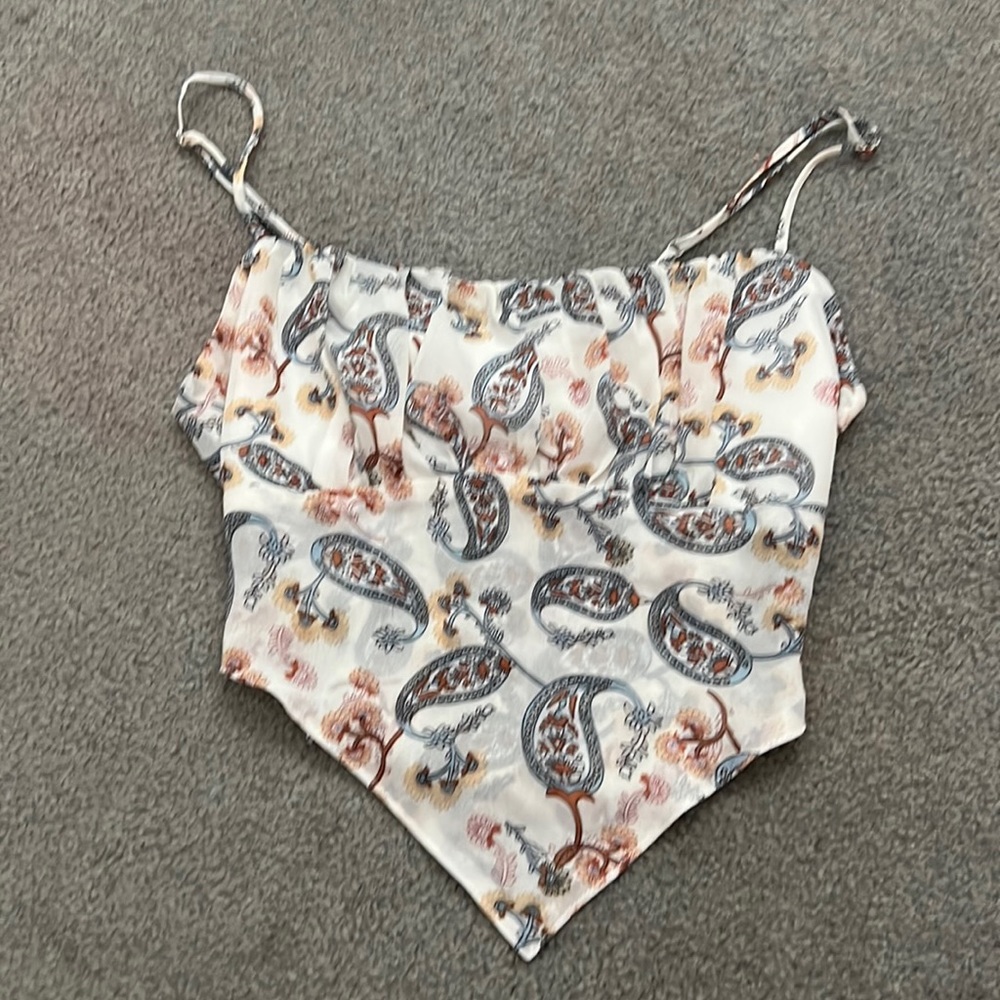 cute summer top that has an adjustable tie in the back